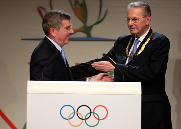 Thomas Bach is congratulated after his election as IOC President by Jacques Rogge, who received the Olympic Order to mark his 12 years in charge