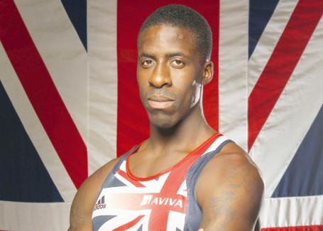 Dwain Chambers_in_front_of_GB_flag