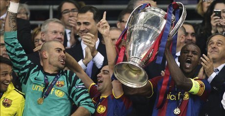 Eric Abidal_lifts_Champions_League_trophy_Wembley_May_2011_resized