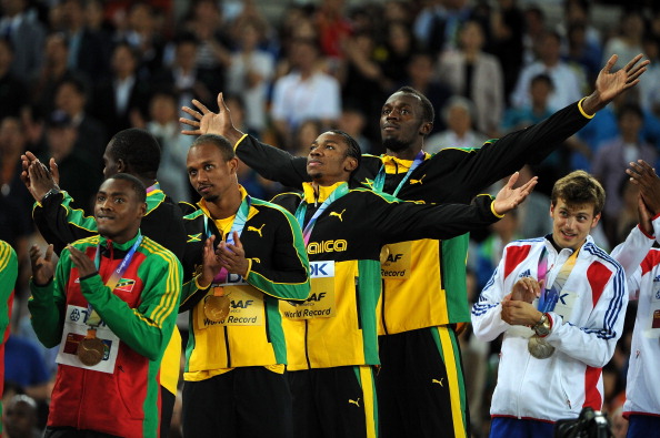 Usain Bolt_on_medal_stand_Daegu_2011