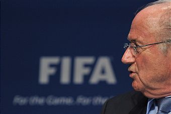 Sepp Blatter_looking_surprised_in_front_of_FIFA_logo