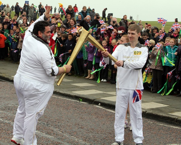 Bosco owner_carries_Olympic_Torch_June_2012