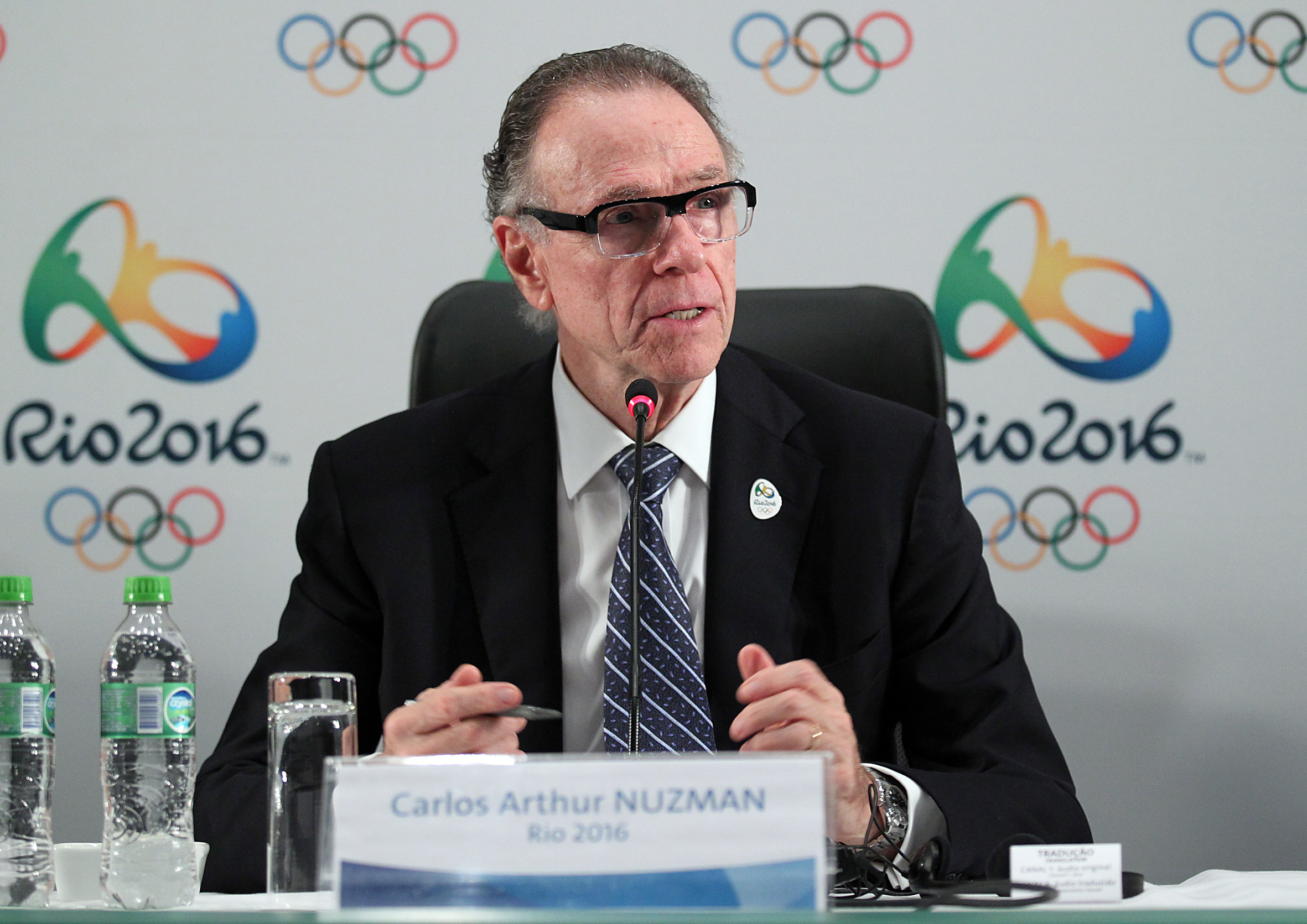 Carlos Nuzman_in_front_of_Rio_2016_logo_and_new_badge
