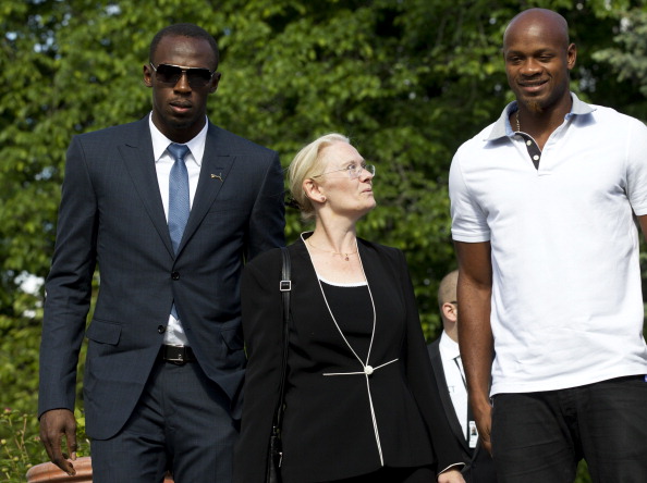 Usain Bolt_L_Asafa_Powell_R_and_British_Ambassador_to_Norway_Jane_Owen_C_08-06-12