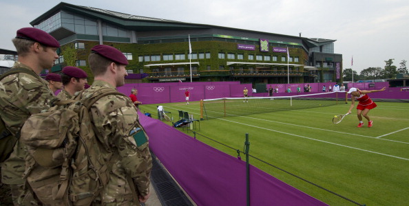 British soldiers_watch_Denmarks_Caroline_Wozniacki_during_her_training_session_at_Wimbledon_29-07-12
