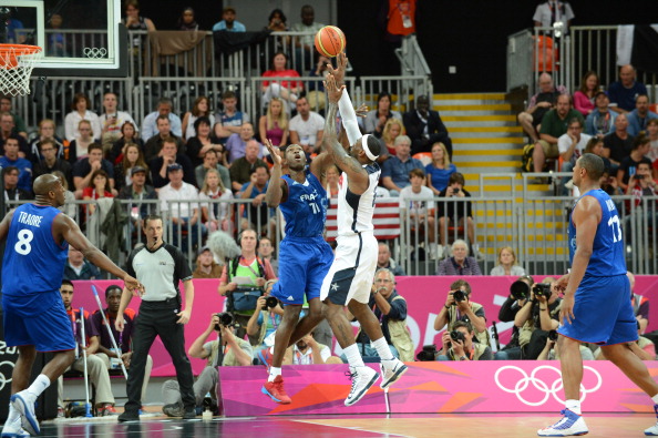 LeBron James_6_of_the_United_States_shoots_versus_Florent_Pietrus_11_of_France_at_the_Olympic_Park_Basketball_Arena_during_the_London_Olympic_Games_30-07-12