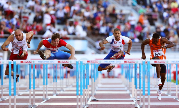 Sergey Shubenkov_of_Russia_wins_gold_ahead_of_Artur_Noga_of_Poland_and_Garfield_Darien_of_France_in_the_Mens_110_Metres_Hurdles_Final_at_the_European_Athletics_Championships_Helsinki_2012