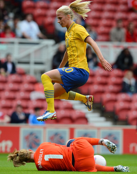 Swedish midfielder_Sofia_Jakobsson_is_denied_by_Great_Britain_goalkeeper_Karen_Bardsley_during_their_London_2012_Olympic_games_warm_up_football_match_at_the_Riverside_Stadium_Middlesbrough