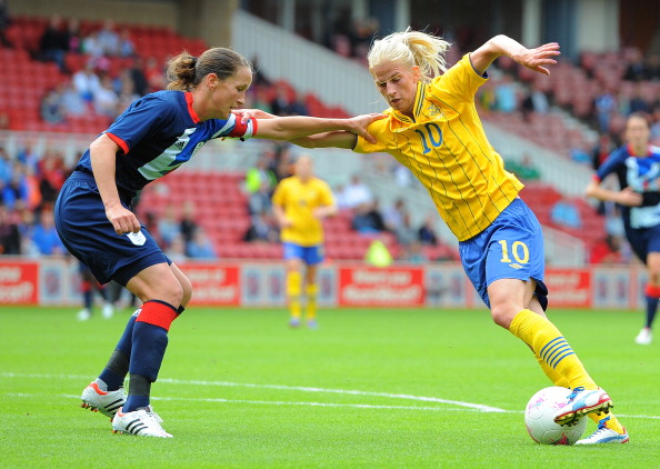 Swedish midfielder_Sofia_Jakobsson_vies_with_Great_Britain_defender_Casey_Stoney_during_their_London_2012_Olympic_Games_warm_up_football_match_at_the_Riverside_Stadium_Middlesbrough
