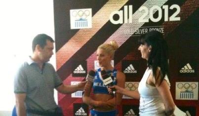 Voula Papachristou_interviewed_in_front_of_Adidas_logo