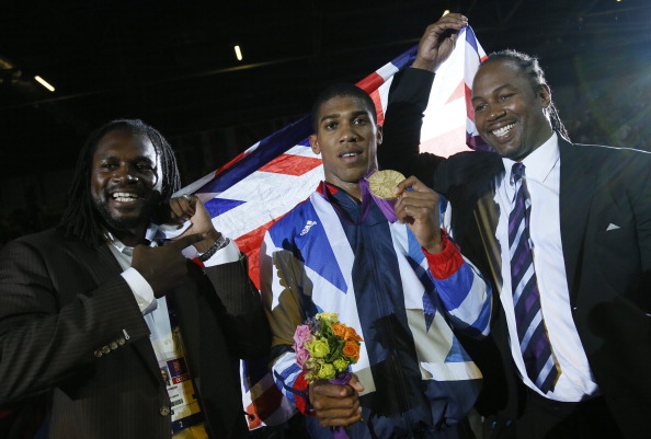 Gold medalist_Anthony_Joshua_C_celebrates_with_former_world_heavweight_boxing_champion_fellow_countryman_Lennox_Lewis_R_and_British_boxer_Audley_Harrison_L