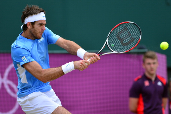 Juan Martin_del_Potro_of_Argentina_plays_a_return_during_his_mens_singles_semi-final_tennis_match_against_Switzerlands_Roger_Federer