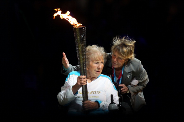 Margaret Maughan_lights_Paralympic_flame_London_2012