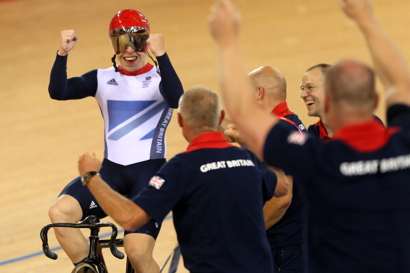 Philip Hindes_of_Great_Britain_celebrates_with_members_of_the_coaching_team_after_setting_a_new_world_record_and_winning_gold_in_the_Mens_Team_Sprint_Track_Cycling