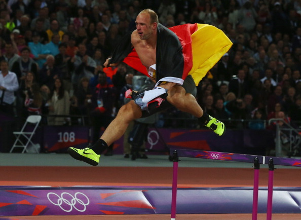 Robert Harting_of_Germany_celebrates_by_jumping_a_hurdle_after_winning_gold_in_the_Mens_Discus_Throw
