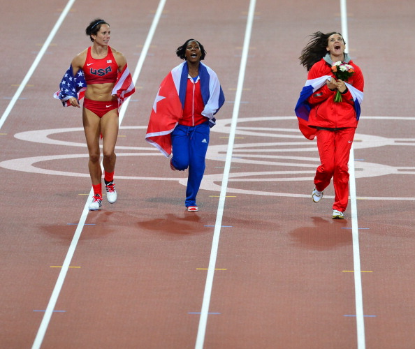 US gold_medalist_Jennifer_Suhr_Cubas_silver_medalist_Yarisley_Silva__Russias_bronze_medalist_Yelena_Isinbayeva_celebrate_with_flags