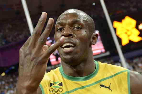 Usain Bolt_gestures_as_he_celebrates_his_three_gold_medals__August_31