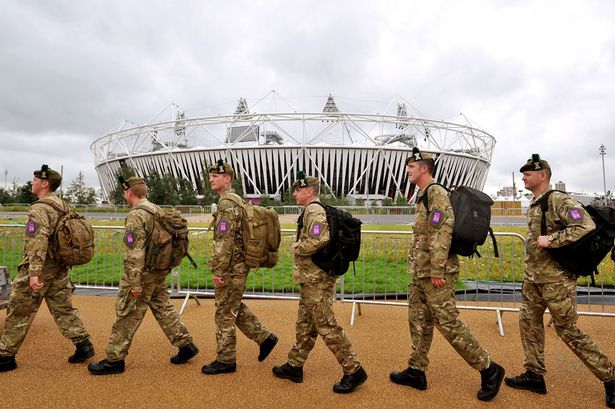 Army troops_walking_past_London_2012_Olympic_Stadium