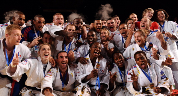 French men_and_women_judo_team_celebrate_their_gold_medal_during_the_podium_ceremony_for_the_team_contest_at_the_Judo_World_Championships