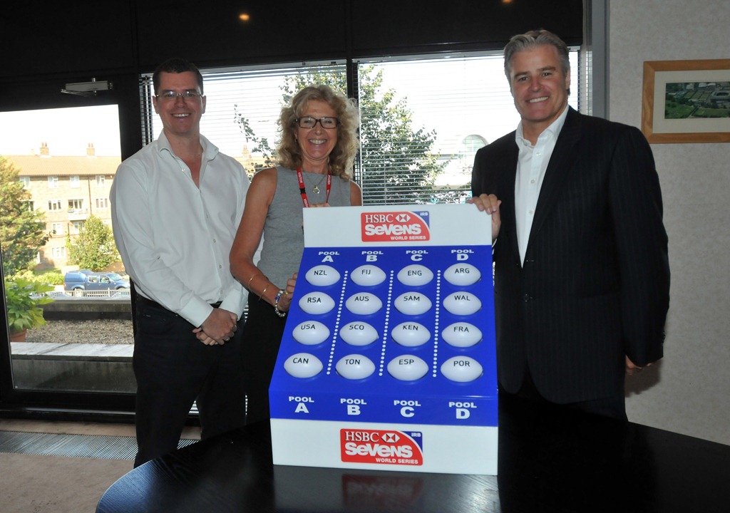 IRB Chief_Executive_Brett_Gosper_right_made_the_draw_for_the_Gold_Coast_Sevens_alongside_IRB_Sevens_Manager_Beth_Coalter_centre_and_adjudicator_Head_of_Rugby_World_Cup_Kit_McConnell_left