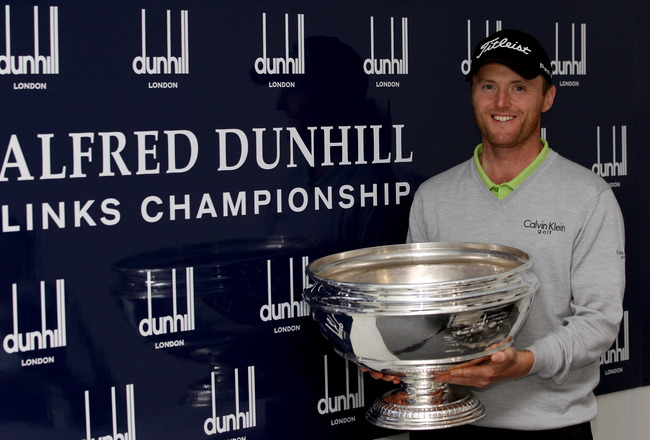 Michael Hoey_with_Alfred_Dunhill_Championship_trophy_October_2011