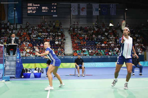 Nathan Robertson_hits_the_shuttlecock_behind_teammate_Gail_Emms_of_Great_Britain_against_Ling_Gao_and_Jun_Zhang_of_China_in_the_mixed_doubles_badminton_gold_medal_match_at_Athens_2004