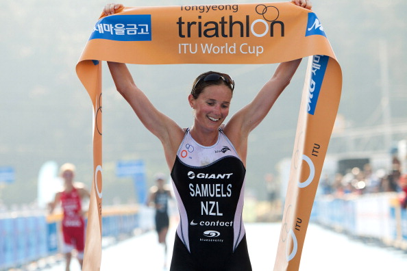 Nicky Samuels_of_New_Zealand_grabs_the_finish_tape_after_winning_the_2012_Tongyeong_ITU_Triathlon_World_Cup