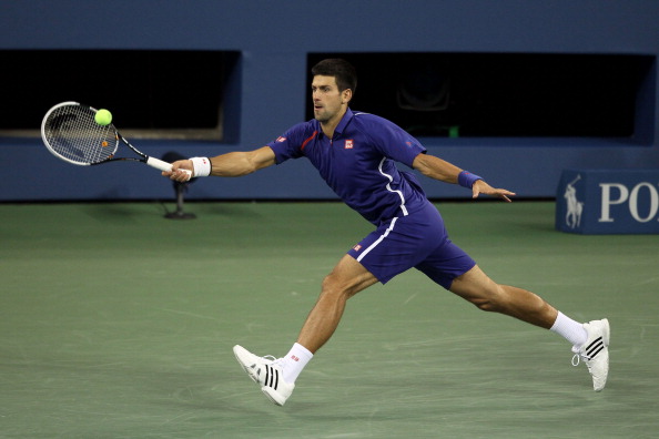 Novak Djokovic_returns_a_shot_during_his_US_Open_mens_singles_final_match_against_Andy_Murray