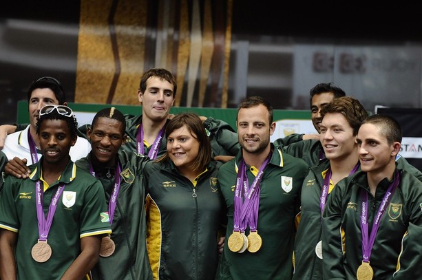 Oscar Pistorius_arrives_back_with_rest_of_South_African_team_from_London_2012_September_11