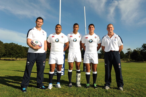 Stuart Lancaster_R_poses_with_Andy_Farrell_L_and_Academy_players_2L-2R_Kyle_Sinckler_Anthony_Watson_and_Brett_Herron_during_the_launch_of_the_BMW_Performance_Academy