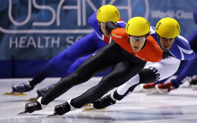 Olivier Jean_C_of_Canada_leads_Thibaut_Fauconnet_R_of_France_and_Jon_Eley_of_Great_Britain_in_the_mens_1000_meter_heats_during_the_ISU_Short_Track_World_Cup_competition