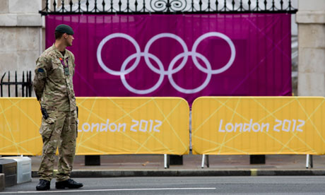 Army guard in front of London 2012 logo