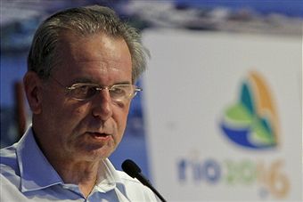 Jacques Rogge in front of Rio 2016 logo