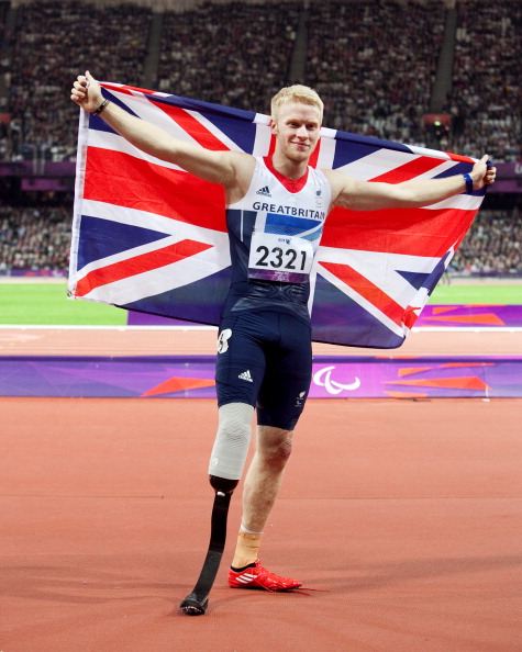Jonnie Peacok with flag after winning London 2012