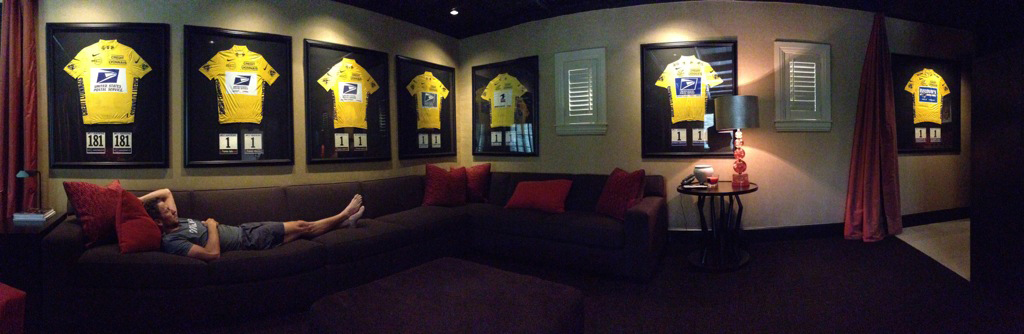 Lance Armstrong in room with yellow jerseys