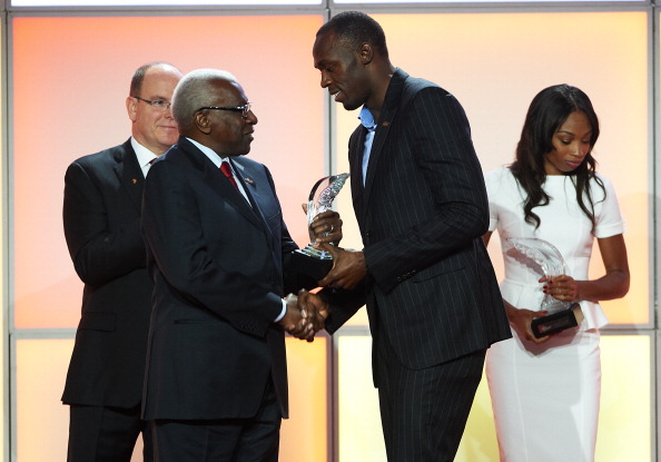 Usain Bolt receives award from Lamine Diack Monaco November 24 2012