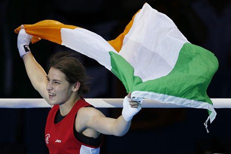 Katie Taylor with Irish flag after winning London 2012 medal