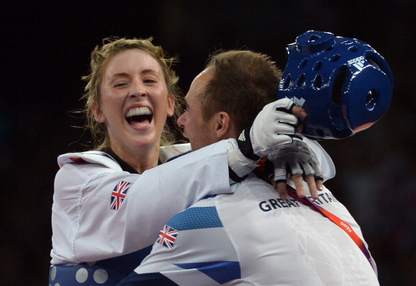 Jade Jones of Great Britain celebrates with coach