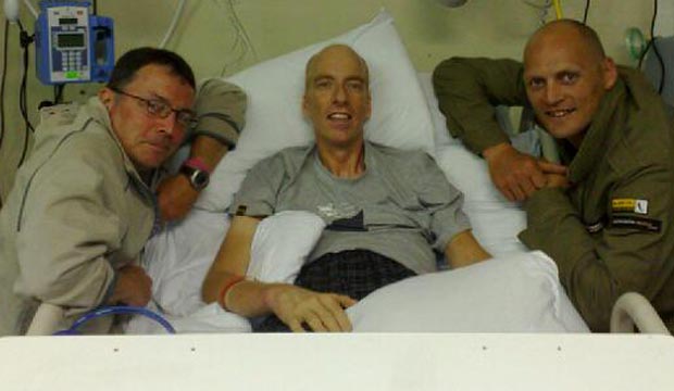 Simon Richardson in hospital bed after accident