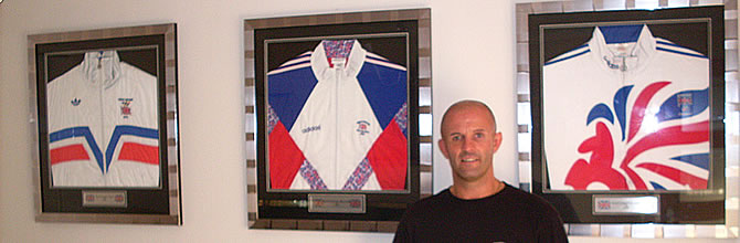 Simon Jackson in front of tracksuits