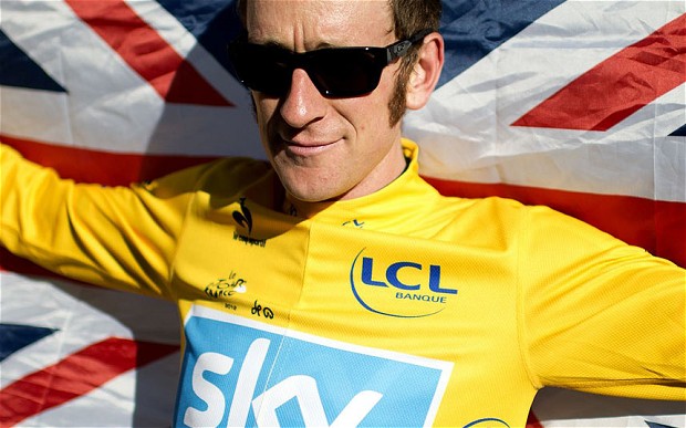 Bradley Wiggins in yellow jersey with GB flag