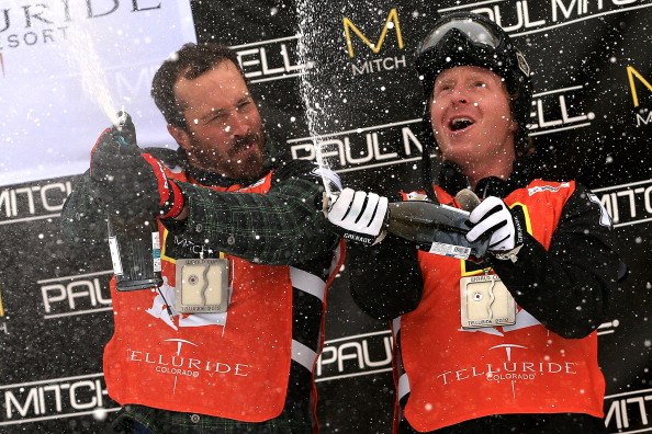 Seth Wescott and Nate Holland of the USA celebrate with champagne on the podium after winning the USANA Snowboardcross World Cup Team Event