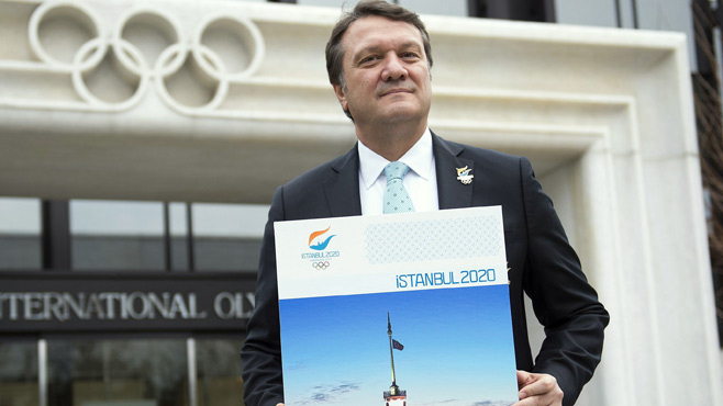 Hasan Arat with Istanbul 2020 poster outside IOC in Lausanne