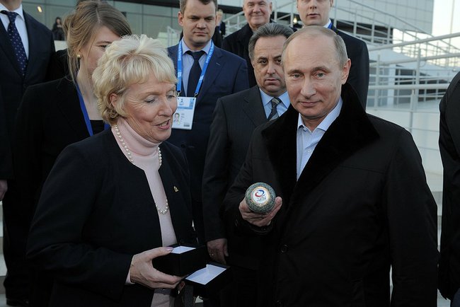 Kate Caithness and Russian President Vladimir Putin are shown around the Ice Cube Curling Centre