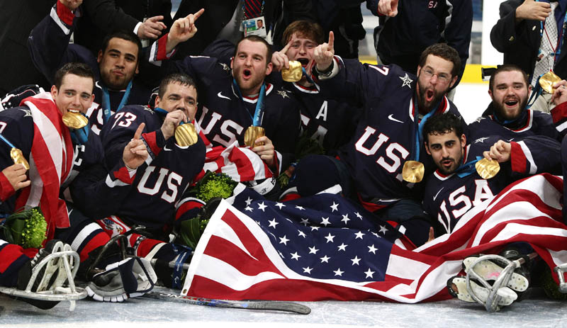 USA sledge hockey team celebrate gold medal Vancouver 2010