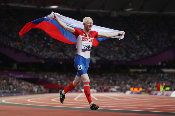 Fedor Trikolich of Russia celebrates winning gold in the Mens 100m - T12 Final