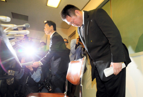Japan Womens Judo national team head coach Ryuji Sonoda bows for apology during a press conference
