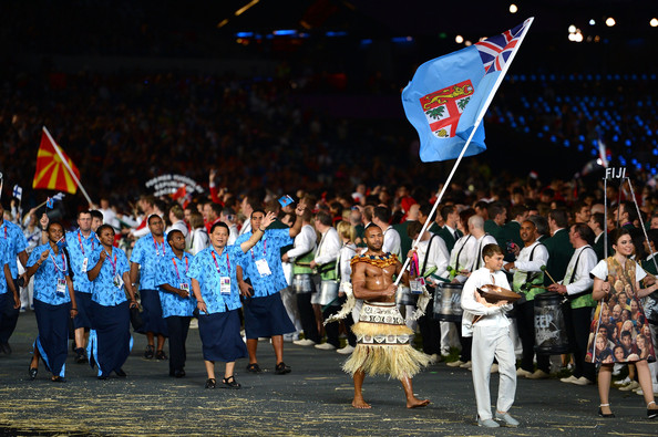 Josateki Naulu carrying Fiji flag at London 2012