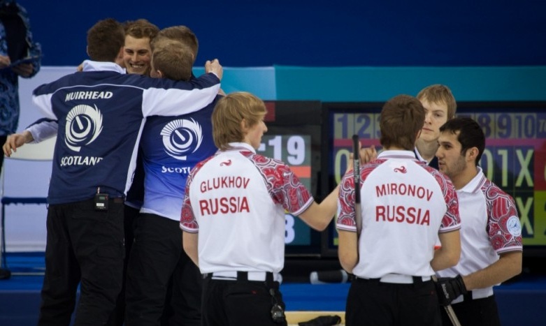 Scotland celebrate winning the 2013 junior world gold medal while Russia look on