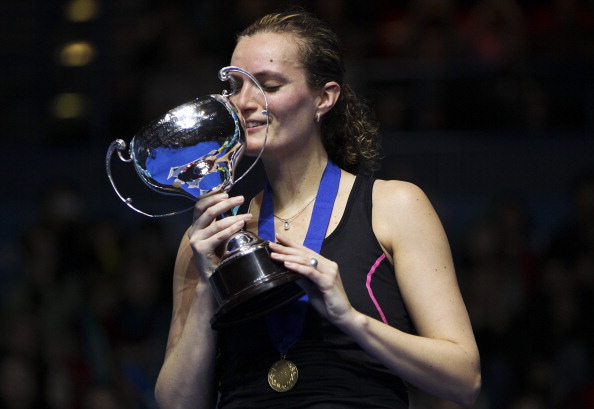 Tine Baun of Denmark celebrates with the trophy after defeating Intanon Ratchanok of Thailand in the final of the womens singles